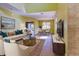 Bright living room featuring a comfortable sofa and stylish decor at 4261 River Bank Way, Punta Gorda, FL 33980