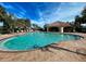 Community pool with a relaxing patio area at 4261 River Bank Way, Punta Gorda, FL 33980