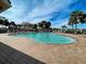 Community pool with plenty of lounge chairs at 4261 River Bank Way, Punta Gorda, FL 33980