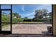 Screened patio with view of backyard at 4261 River Bank Way, Punta Gorda, FL 33980