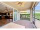 Screened patio connecting kitchen and backyard at 4261 River Bank Way, Punta Gorda, FL 33980