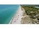 Beach with swimmers and sunbathers at 749 Portwine Ct, Englewood, FL 34223