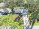 Aerial view of house and surrounding trees at 8457 Bristol Ave, North Port, FL 34291