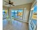 Bright breakfast nook offers stunning waterfront views from large windows, creating a serene dining experience at 1 Colony Point Dr # 3C, Punta Gorda, FL 33950