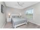 Bright bedroom with a queen-size bed and window blinds at 2380 Ann Arbor Rd, North Port, FL 34286