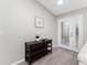 Entryway with dark wood console table and white door with glass accents at 2380 Ann Arbor Rd, North Port, FL 34286