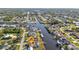 Aerial view of a waterfront property with canal access and lush surroundings in a residential neighborhood at 4107 Rock Creek Dr, Port Charlotte, FL 33948