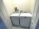 Bright laundry room featuring a matching white Maytag washer and dryer set on marble floors at 4530 Turnberry Cir, North Port, FL 34288