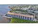 Exterior view of waterfront condos with garage parking below each unit and beautiful water views at 900 E Marion Ave # 1301, Punta Gorda, FL 33950