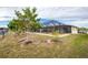 A spacious backyard with tropical plants and a screened pool to enjoy outdoor life at 109 Peckham Se St, Port Charlotte, FL 33952