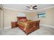 Bedroom with a queen sized bed, two windows, and tile floors at 109 Peckham Se St, Port Charlotte, FL 33952