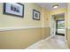 Bright foyer with neutral walls, elegant crown molding, and views into the front yard at 109 Peckham Se St, Port Charlotte, FL 33952