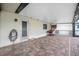 Covered brick patio with a door, window, and outdoor basketball game at 109 Peckham Se St, Port Charlotte, FL 33952