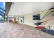 Expansive covered brick patio for outdoor lounging and dining with a light-colored ceiling and views at 109 Peckham Se St, Port Charlotte, FL 33952