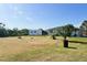 Large back yard with shed and trees, offering ample space for outdoor activities and relaxation at 12143 Du Barry Ave, Port Charlotte, FL 33981
