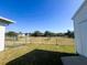 View of a fenced backyard with shed and green grass at 12143 Du Barry Ave, Port Charlotte, FL 33981