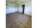 Neutral bedroom with tile floors, ceiling fan, and good closet space, offering a serene living area at 12143 Du Barry Ave, Port Charlotte, FL 33981