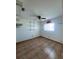Bedroom with ceiling fan, tile floors, small window and shelving at 12143 Du Barry Ave, Port Charlotte, FL 33981