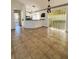 Bright dining room with tile floors, chandelier, and sliding glass doors leading to the backyard at 12143 Du Barry Ave, Port Charlotte, FL 33981