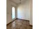 Inviting entryway features tiled flooring, a pendant light, and a front door with a glass window at 12143 Du Barry Ave, Port Charlotte, FL 33981