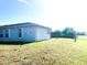 View of the home exterior featuring a chain link fenced yard and decorative seahorse art at 12143 Du Barry Ave, Port Charlotte, FL 33981