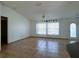 Bright, spacious living room featuring tiled floors, neutral walls, and a ceiling fan for added comfort at 12143 Du Barry Ave, Port Charlotte, FL 33981