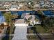 Beautiful aerial view of the waterfront property with a well-maintained yard and a long private dock at 193 Beeney Se Rd, Port Charlotte, FL 33952