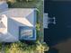 An aerial view of a home featuring a private dock and an enclosed swimming pool at 193 Beeney Se Rd, Port Charlotte, FL 33952