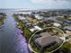 Waterfront home features a private dock, screened-in lanai, and well-maintained landscaping at 193 Beeney Se Rd, Port Charlotte, FL 33952