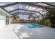 Relaxing screened lanai featuring a private pool, perfect for enjoying sunny days and outdoor entertaining at 193 Beeney Se Rd, Port Charlotte, FL 33952