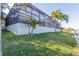 A stunning enclosed pool surrounded by lush tropical plants, offering relaxation and privacy at 193 Beeney Se Rd, Port Charlotte, FL 33952