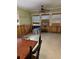 View of the dining room featuring natural light, ceiling fan, and exposed walls undergoing renovations at 14262 Kent Rd, Port Charlotte, FL 33953