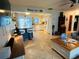 Open-concept living and kitchen area with tile floors and a breakfast bar at 1434 Viscaya Dr, Port Charlotte, FL 33952