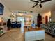 Open concept living room featuring a clear view to the kitchen and dining area with bar stool seating at 1434 Viscaya Dr, Port Charlotte, FL 33952