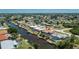Charming waterfront property showcasing a private pool, dock, and picturesque waterway views at 164 Chelsea Nw Ct, Port Charlotte, FL 33952