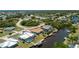 Waterfront home featuring a pool, private dock, scenic views, and desirable canal-front living at 164 Chelsea Nw Ct, Port Charlotte, FL 33952