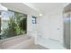 Clean bathroom features a bathtub, shower, and bright natural light at 164 Chelsea Nw Ct, Port Charlotte, FL 33952