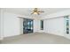 Bright and spacious bedroom with large windows and sliding door access at 164 Chelsea Nw Ct, Port Charlotte, FL 33952