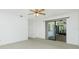 Spacious bedroom with plush carpet and sliding glass doors at 164 Chelsea Nw Ct, Port Charlotte, FL 33952