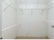 Walk-in closet featuring shelving and a hanging rod for optimal storage at 164 Chelsea Nw Ct, Port Charlotte, FL 33952