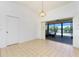 Bright dining area with tile flooring and sliding glass doors to the lanai at 164 Chelsea Nw Ct, Port Charlotte, FL 33952