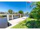 Private dock on a waterfront property, perfect for boating and enjoying the water views at 164 Chelsea Nw Ct, Port Charlotte, FL 33952