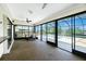 Enclosed lanai featuring large windows offering plenty of natural light and a view of the pool at 164 Chelsea Nw Ct, Port Charlotte, FL 33952