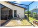Cozy outdoor patio with rock garden and access to the home's interior at 164 Chelsea Nw Ct, Port Charlotte, FL 33952