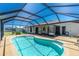 Inviting covered pool area, perfect for relaxation and entertainment. Includes a screened enclosure at 164 Chelsea Nw Ct, Port Charlotte, FL 33952