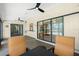 Relaxing sunroom featuring a ceiling fan and an outside view of the pool at 164 Chelsea Nw Ct, Port Charlotte, FL 33952