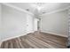 Bedroom featuring wood-look flooring, neutral paint, and a ceiling fan at 30087 Alder Rd, Punta Gorda, FL 33982