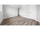 Bright bedroom showcasing wood-look floors and neutral wall color at 30087 Alder Rd, Punta Gorda, FL 33982
