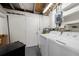 Finished laundry room with washer, dryer, and utility shelving at 30087 Alder Rd, Punta Gorda, FL 33982