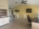 Bright, open dining room features tile flooring and a stylish ceiling fan at 3761 Peace River Dr, Punta Gorda, FL 33983